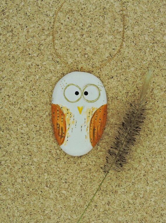 Small orange owl, a wooden owl ornament.