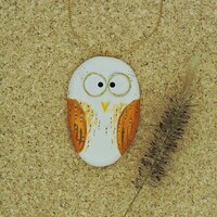 Small orange owl, a wooden owl ornament.